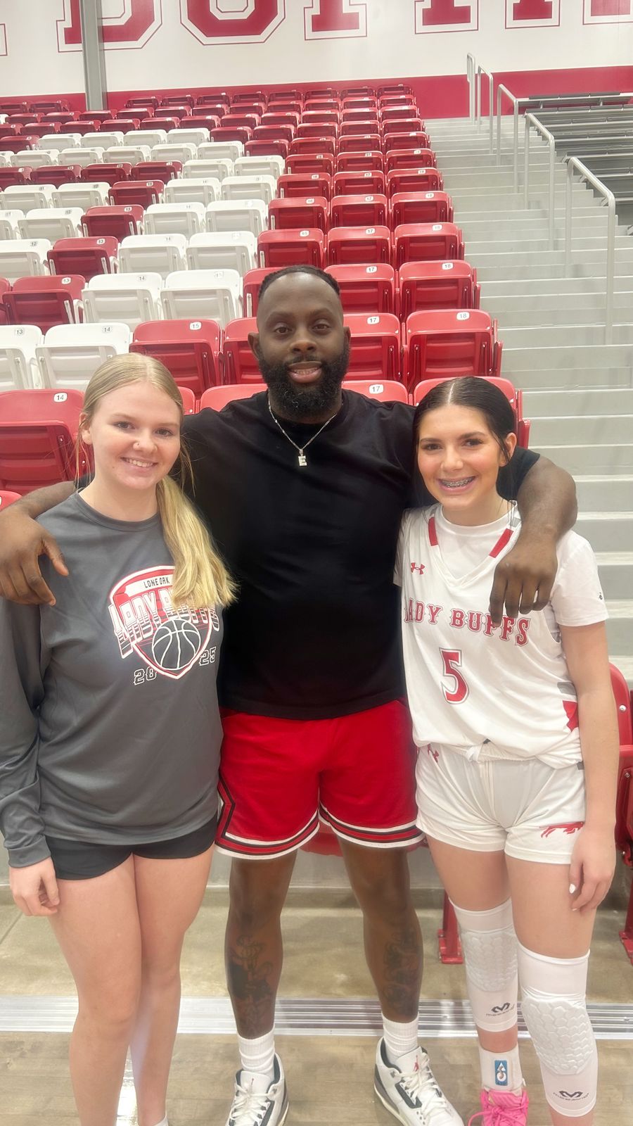Coach Black with his players
