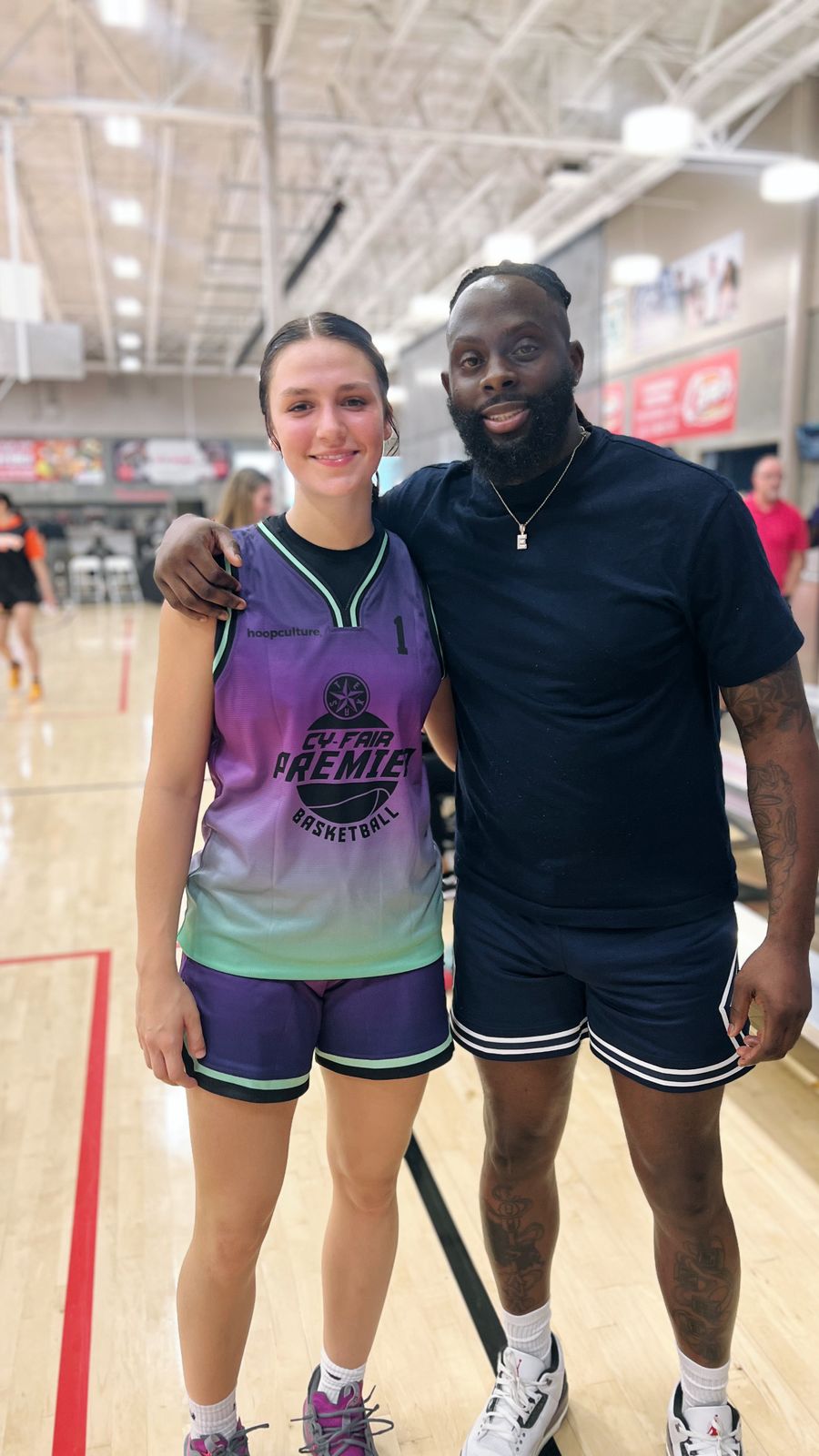 A Dog Pound player with Coach Black