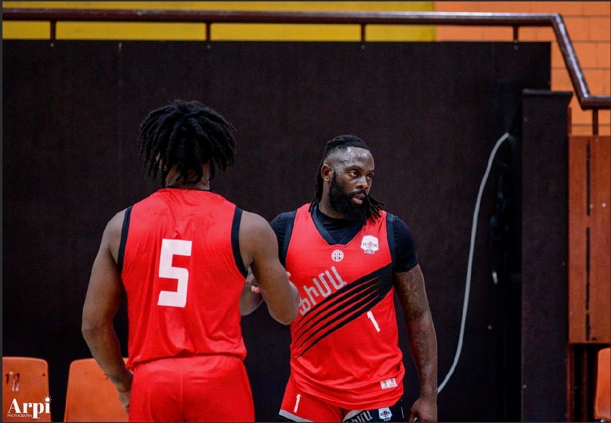 Coach Black with a teammate during a pro game