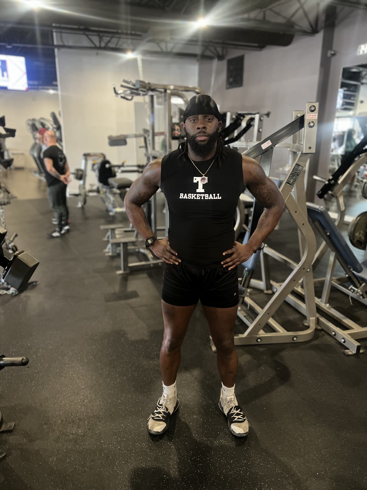 Coach Black putting in work in the weight room