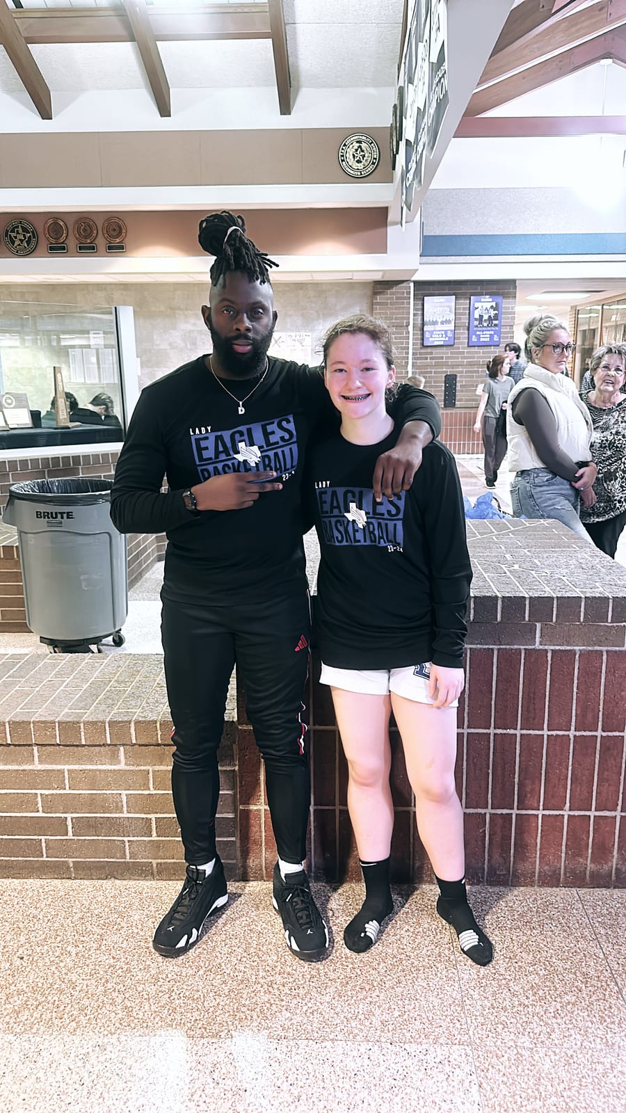 Coach Black with one of his players after a game
