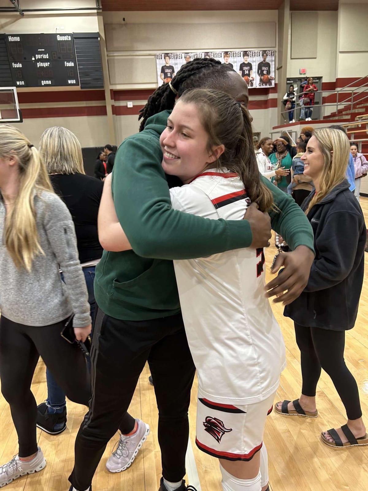 Coach Black sharing a moment with a player postgame