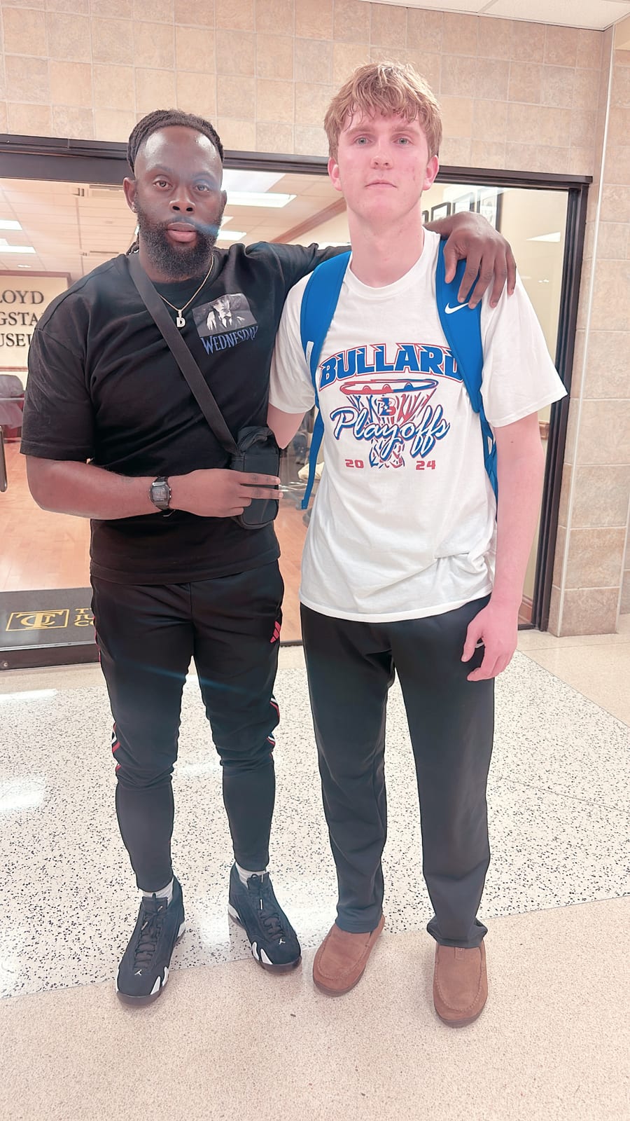 Coach Black with a high school player he trains