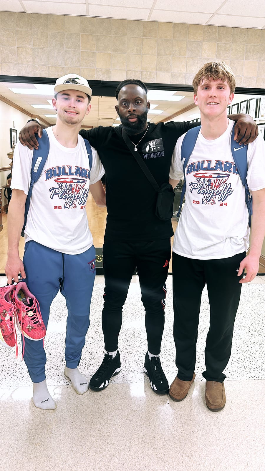 Coach Black with two of his playoff-bound players