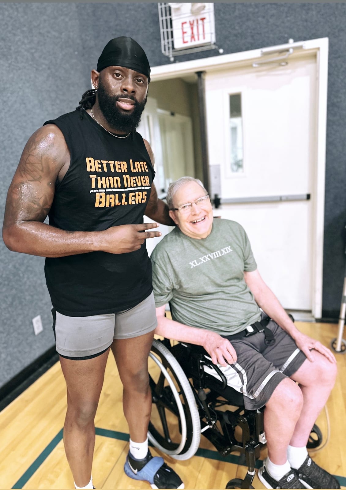 Coach Black mentoring a Better Late Than Never baller